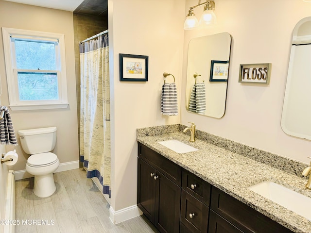 7 Rosewood Dr, Milltown, NJ 08850 - full bath with toilet, double vanity, baseboards, and curtained shower