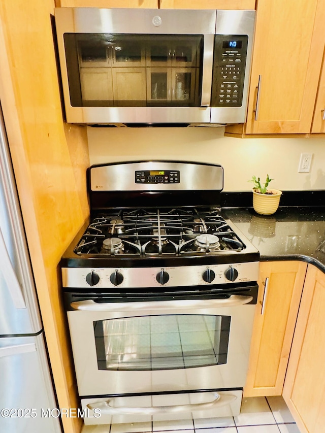 7 Rosewood Dr, Milltown, NJ 08850 - kitchen featuring stainless steel appliances, light brown cabinets, and dark stone counters