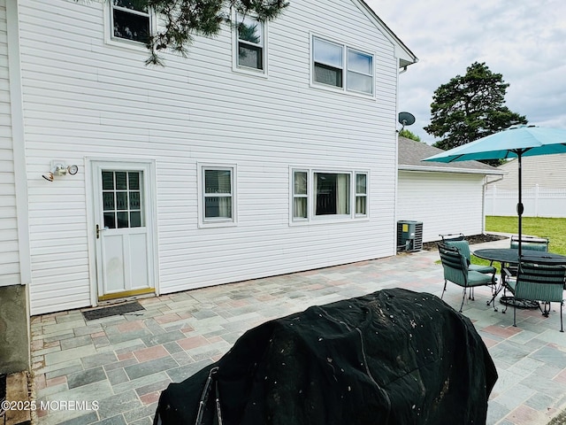 7 Rosewood Dr, Milltown, NJ 08850 - rear view of property with a patio area, outdoor dining space, central AC, and roof with shingles