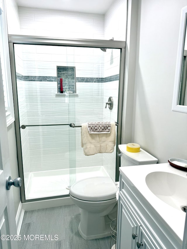 132 Seaview Ave, Brick, NJ 08723 - bathroom with vanity, toilet, and a stall shower