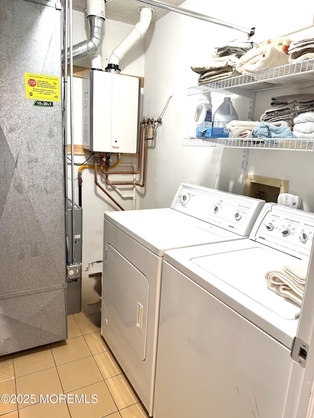 132 Seaview Ave, Brick, NJ 08723 - laundry room with washing machine and dryer, heating unit, tankless water heater, and light tile patterned floors