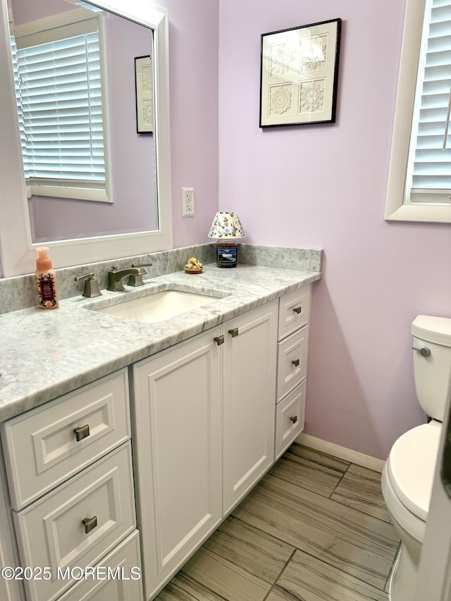 132 Seaview Ave, Brick, NJ 08723 - half bath featuring toilet, vanity, and baseboards