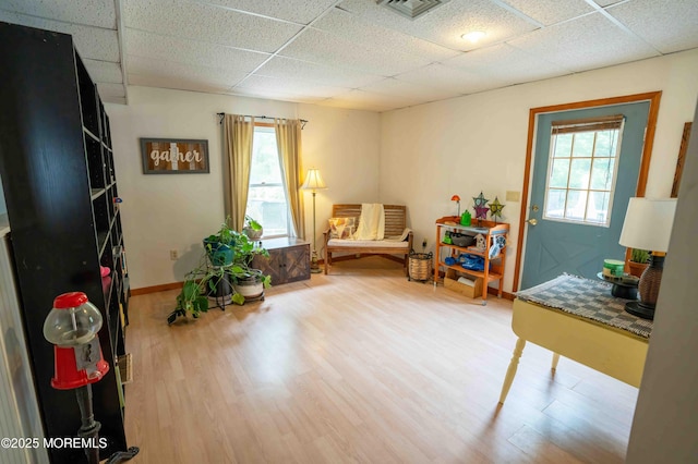 817 Wright Debow Rd, Jackson, NJ 08527 - living area featuring wood finished floors, a paneled ceiling, and baseboards