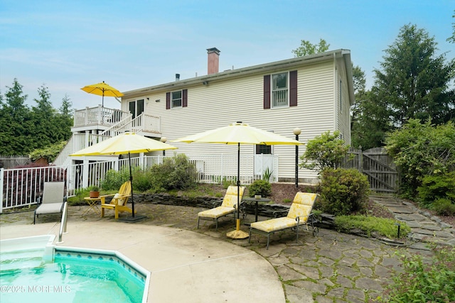 817 Wright Debow Rd, Jackson, NJ 08527 - rear view of property with a gate, a patio area, and a chimney