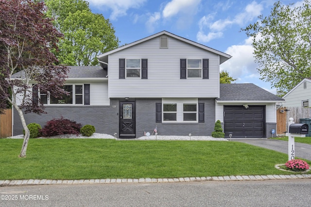 120 Lake Winnepesaukee Dr, Little Egg Harbor, NJ 08087 - tri-level home featuring an attached garage, brick siding, asphalt driveway, and a shingled roof
