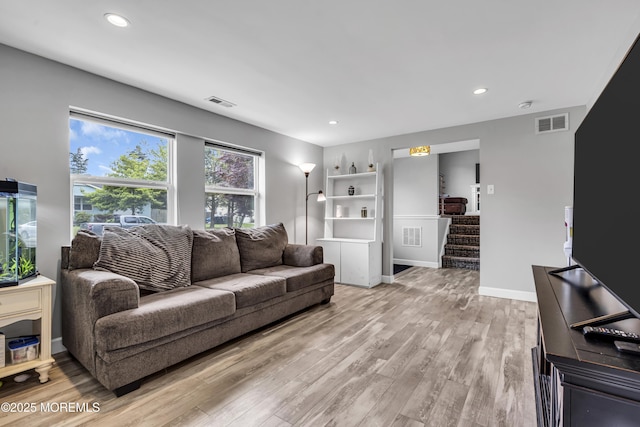 120 Lake Winnepesaukee Dr, Little Egg Harbor, NJ 08087 - living area featuring light wood-style floors, stairs, recessed lighting, and baseboards