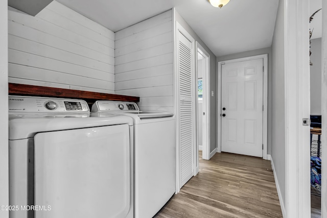 120 Lake Winnepesaukee Dr, Little Egg Harbor, NJ 08087 - laundry area with washer and clothes dryer, light wood finished floors, and baseboards