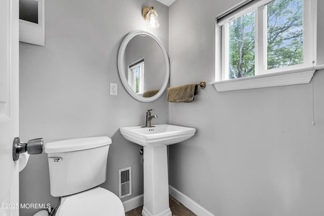 120 Lake Winnepesaukee Dr, Little Egg Harbor, NJ 08087 - bathroom featuring toilet, wood finished floors, baseboards, and a sink