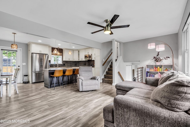 120 Lake Winnepesaukee Dr, Little Egg Harbor, NJ 08087 - living area with light wood-type flooring, ceiling fan, stairs, baseboards, and recessed lighting