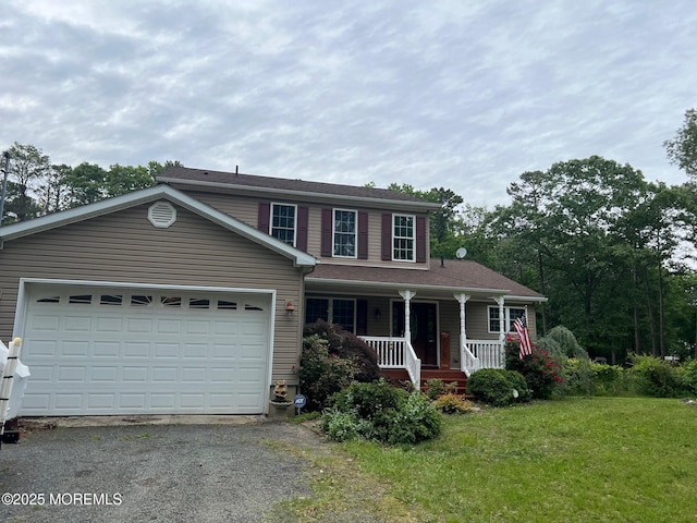 10 Hillside Ave, Tuckerton, NJ 08087 - view of front facade featuring a porch, driveway, a front yard, and an attached garage
