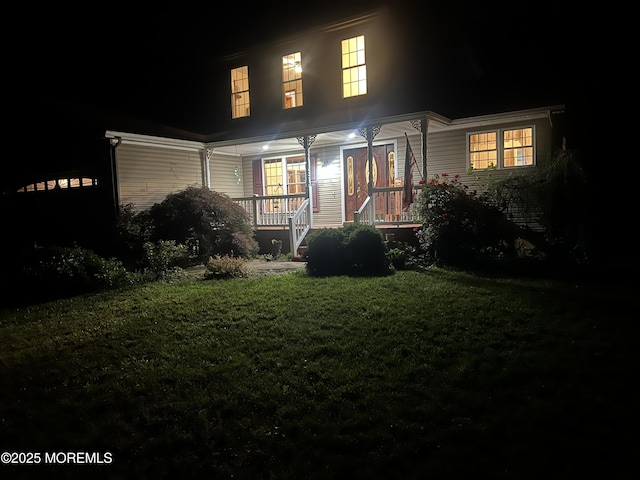 10 Hillside Ave, Tuckerton, NJ 08087 - back of house at twilight featuring covered porch and a lawn