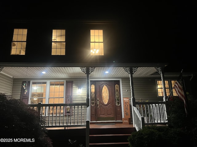 10 Hillside Ave, Tuckerton, NJ 08087 - exterior entry at night featuring a porch