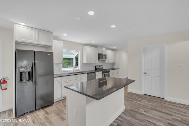 352 Leesville Rd, Jackson, NJ 08527 - kitchen with appliances with stainless steel finishes, a sink, light wood-style flooring, backsplash, and recessed lighting
