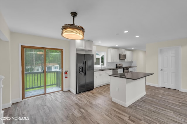 352 Leesville Rd, Jackson, NJ 08527 - kitchen with stainless steel appliances, light wood finished floors, plenty of natural light, dark countertops, and recessed lighting