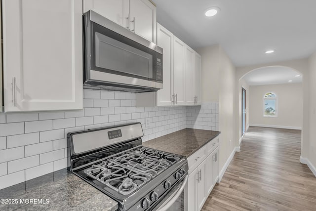 352 Leesville Rd, Jackson, NJ 08527 - kitchen with appliances with stainless steel finishes, arched walkways, white cabinetry, light wood-type flooring, and recessed lighting