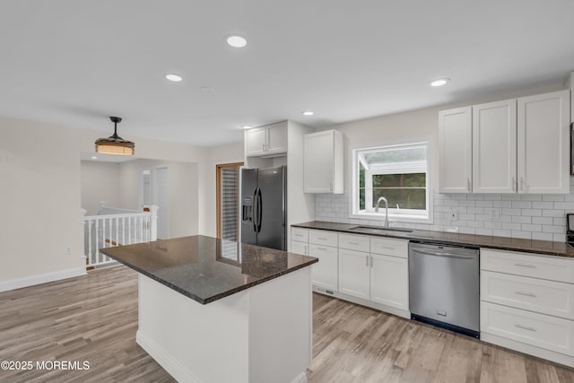 352 Leesville Rd, Jackson, NJ 08527 - kitchen featuring dishwasher, fridge with ice dispenser, a sink, light wood-style flooring, and tasteful backsplash