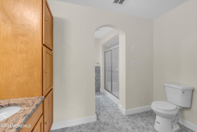 352 Leesville Rd, Jackson, NJ 08527 - bathroom with baseboards, a shower stall, toilet, vanity, and tile patterned floors