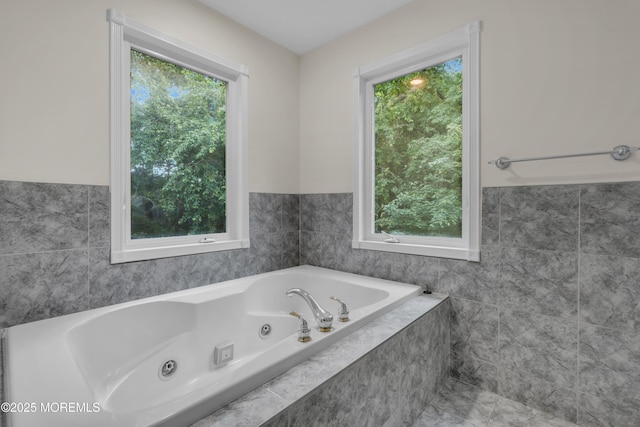 352 Leesville Rd, Jackson, NJ 08527 - bathroom featuring a tub with jets, tile walls, and wainscoting