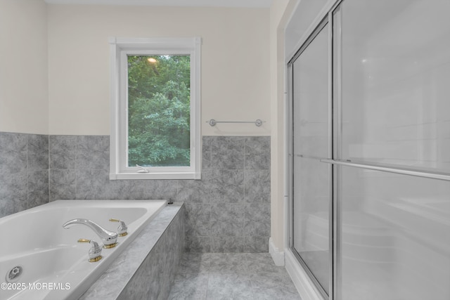 352 Leesville Rd, Jackson, NJ 08527 - full bathroom with plenty of natural light, a stall shower, tile walls, a garden tub, and tile patterned flooring
