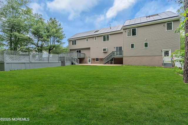 352 Leesville Rd, Jackson, NJ 08527 - back of house featuring stairway, solar panels, and a wooden deck
