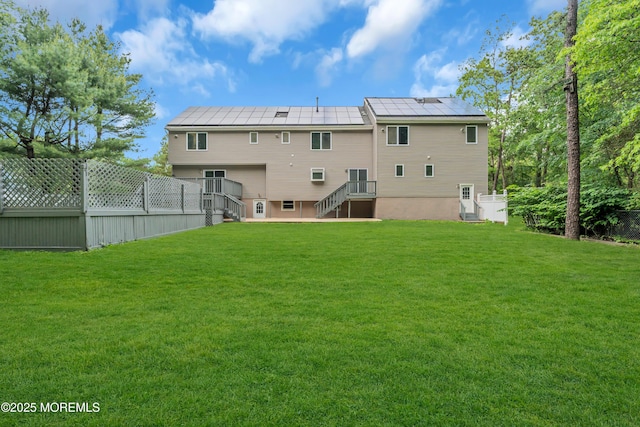 352 Leesville Rd, Jackson, NJ 08527 - rear view of house with roof mounted solar panels and stairway