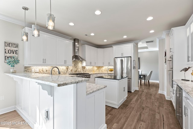 2 Haley Cir, Barnegat, NJ 08005 - kitchen featuring wall chimney exhaust hood, stainless steel appliances, a peninsula, white cabinetry, and recessed lighting