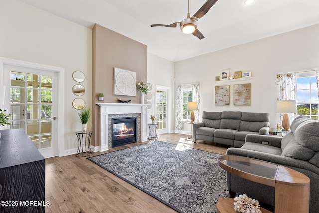 2 Haley Cir, Barnegat, NJ 08005 - living room with a ceiling fan, wood finished floors, a glass covered fireplace, a towering ceiling, and baseboards