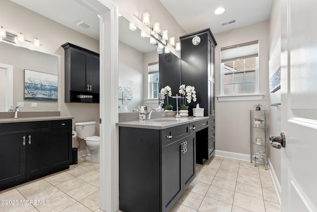 2 Haley Cir, Barnegat, NJ 08005 - bathroom featuring tile patterned floors, two vanities, toilet, and baseboards