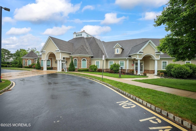 2 Haley Cir, Barnegat, NJ 08005 - view of front facade with stone siding, french doors, and a front yard
