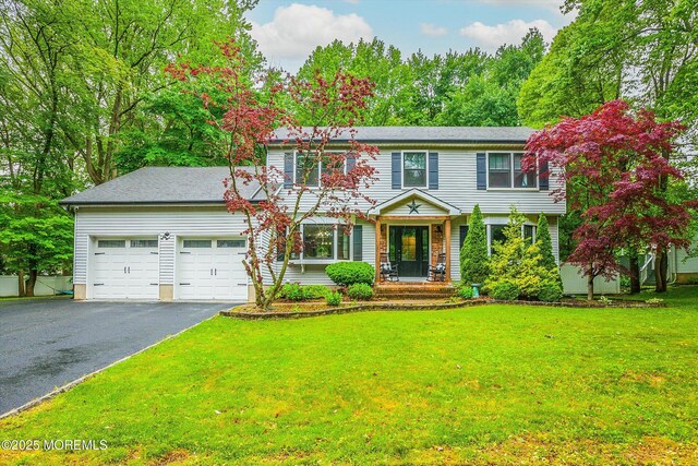25 Merritt Ter, Matawan, NJ 07747 - colonial inspired home featuring driveway, a garage, and a front yard