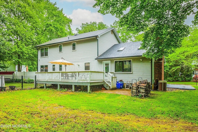 25 Merritt Ter, Matawan, NJ 07747 - back of house featuring a wooden deck, cooling unit, and roof with shingles