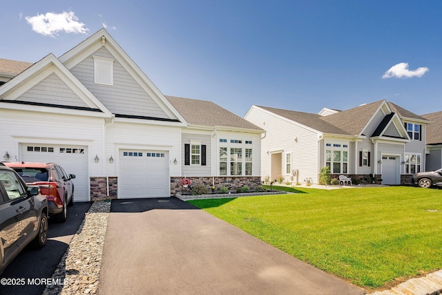 21 Gulfstream Rd, New Egypt, NJ 08533 - view of front facade with driveway, a front lawn, stone siding, and a garage