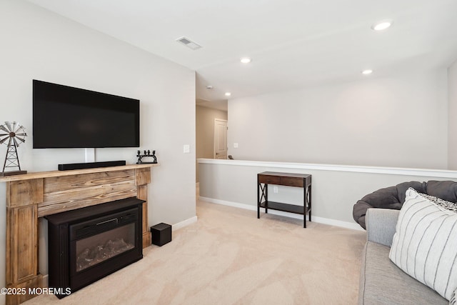 21 Gulfstream Rd, New Egypt, NJ 08533 - living area with light carpet, baseboards, a glass covered fireplace, and recessed lighting