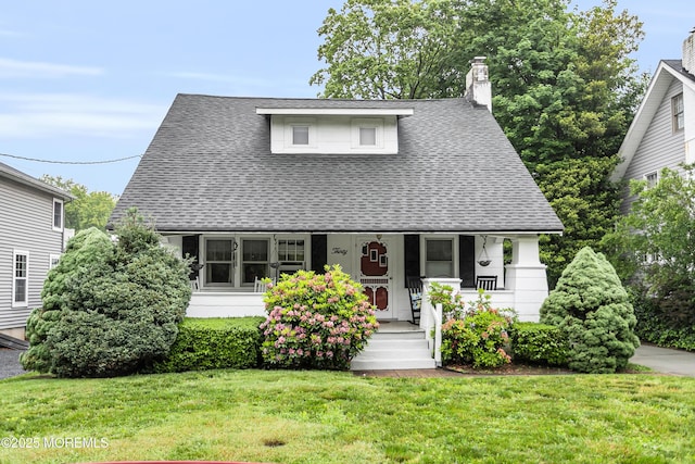 30 Balloch Pl, Red Bank, NJ 07701 - view of front of property with a porch, roof with shingles, a front yard, and a chimney