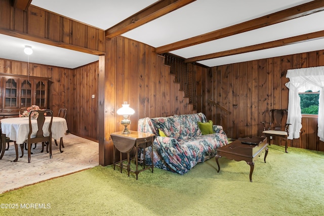 30 Balloch Pl, Red Bank, NJ 07701 - living area with carpet floors, beamed ceiling, wood walls, and stairs
