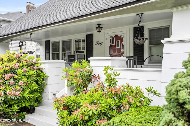 30 Balloch Pl, Red Bank, NJ 07701 - property entrance with a porch and roof with shingles