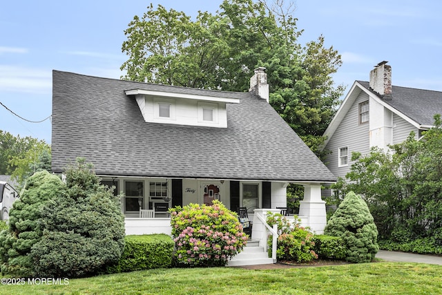 30 Balloch Pl, Red Bank, NJ 07701 - view of front of property with a porch, a shingled roof, and a front lawn