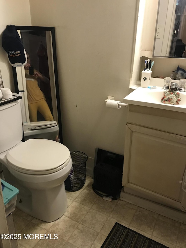 289 Port Monmouth Rd, North Middletown, NJ 07748 - half bath featuring vanity and toilet