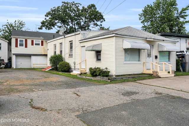 289 Port Monmouth Rd, North Middletown, NJ 07748 - view of front of house with an attached garage and driveway