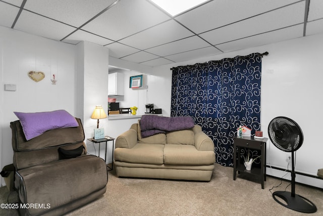 289 Port Monmouth Rd, North Middletown, NJ 07748 - living area with a drop ceiling, carpet floors, and a baseboard radiator