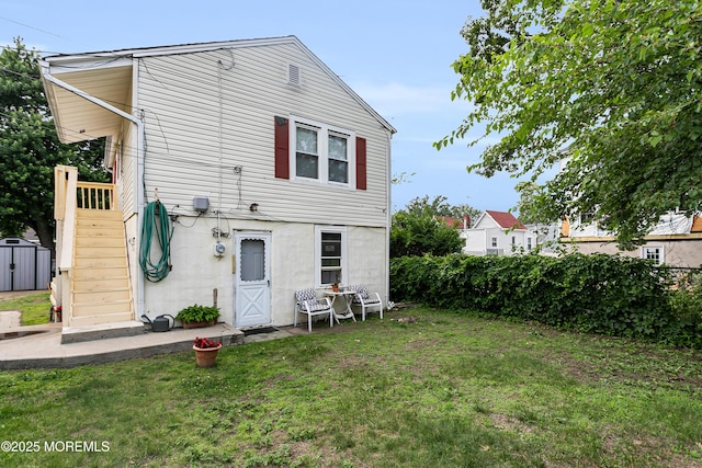 289 Port Monmouth Rd, North Middletown, NJ 07748 - rear view of house featuring a lawn and stairs