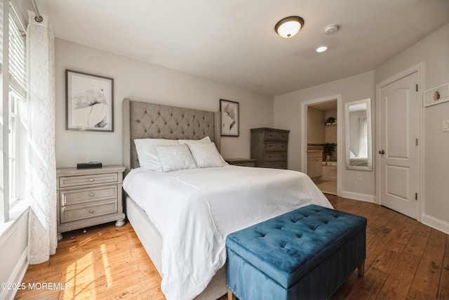 40 Dickerson Ln, Old Bridge, NJ 08857 - bedroom featuring light wood-type flooring, baseboards, and ensuite bath
