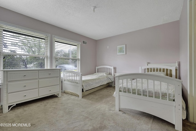 1299 E County Line Rd, Lakewood, NJ 08701 - bedroom featuring light colored carpet and a textured ceiling