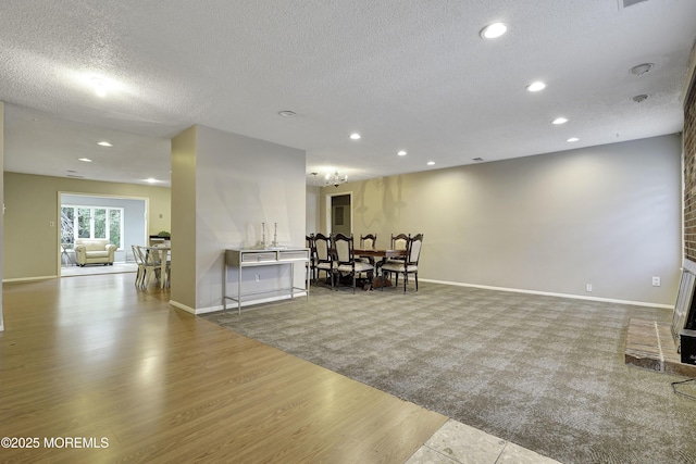 1299 E County Line Rd, Lakewood, NJ 08701 - carpeted dining area with a textured ceiling, recessed lighting, wood finished floors, and baseboards