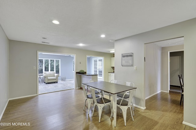 1299 E County Line Rd, Lakewood, NJ 08701 - dining space with light wood finished floors, baseboards, and recessed lighting