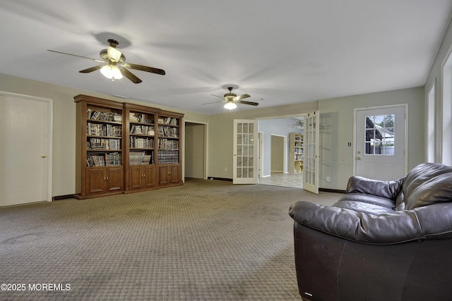 1299 E County Line Rd, Lakewood, NJ 08701 - living area with french doors, a ceiling fan, baseboards, and carpet flooring