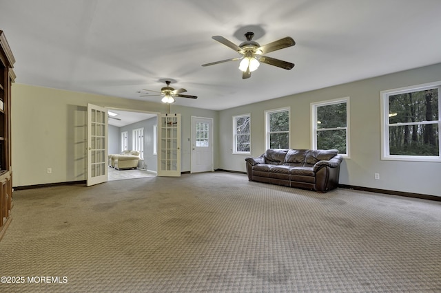 1299 E County Line Rd, Lakewood, NJ 08701 - carpeted living area featuring baseboards, a ceiling fan, and french doors