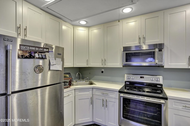 1299 E County Line Rd, Lakewood, NJ 08701 - kitchen with stainless steel appliances, a sink, light countertops, and recessed lighting