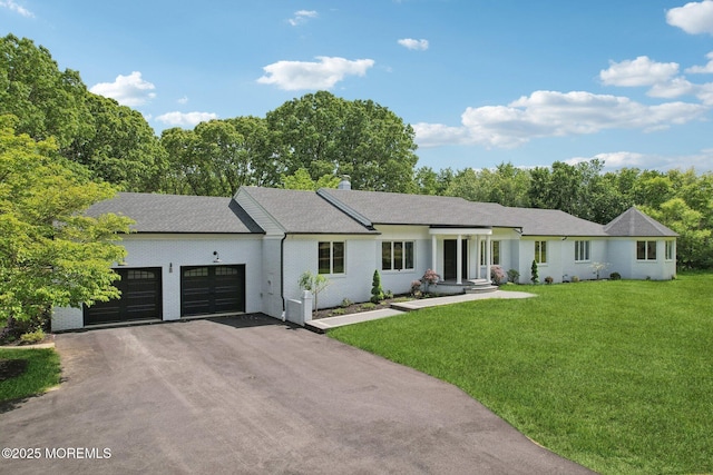 8 Olden Ct, Colts Neck, NJ 07722 - single story home featuring an attached garage, driveway, a front yard, brick siding, and a chimney