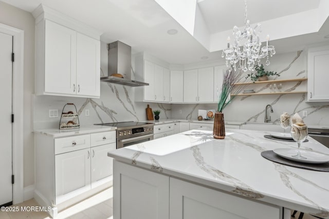 8 Olden Ct, Colts Neck, NJ 07722 - kitchen featuring wall chimney range hood, stainless steel range with electric cooktop, tasteful backsplash, white cabinets, and open shelves
